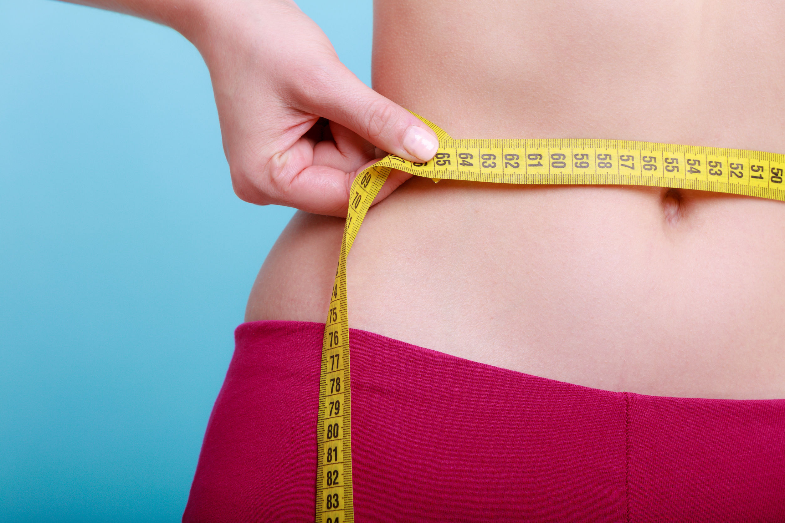measuring tape on waist weight loss program without strict diet and exercise life changing program