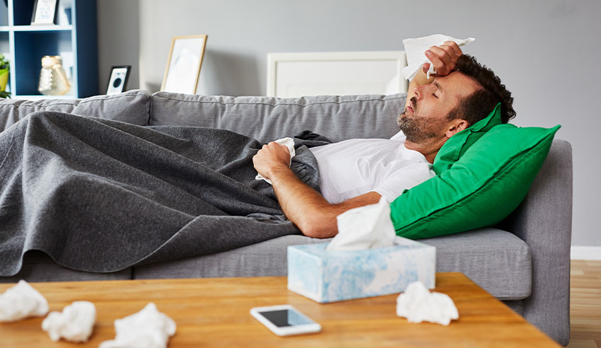 Sick man on couch