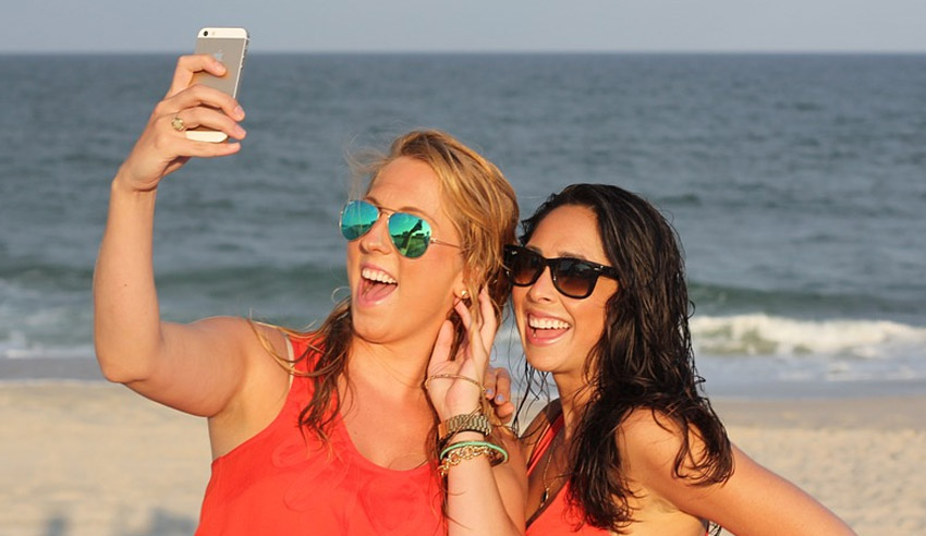 Young women taking selfie